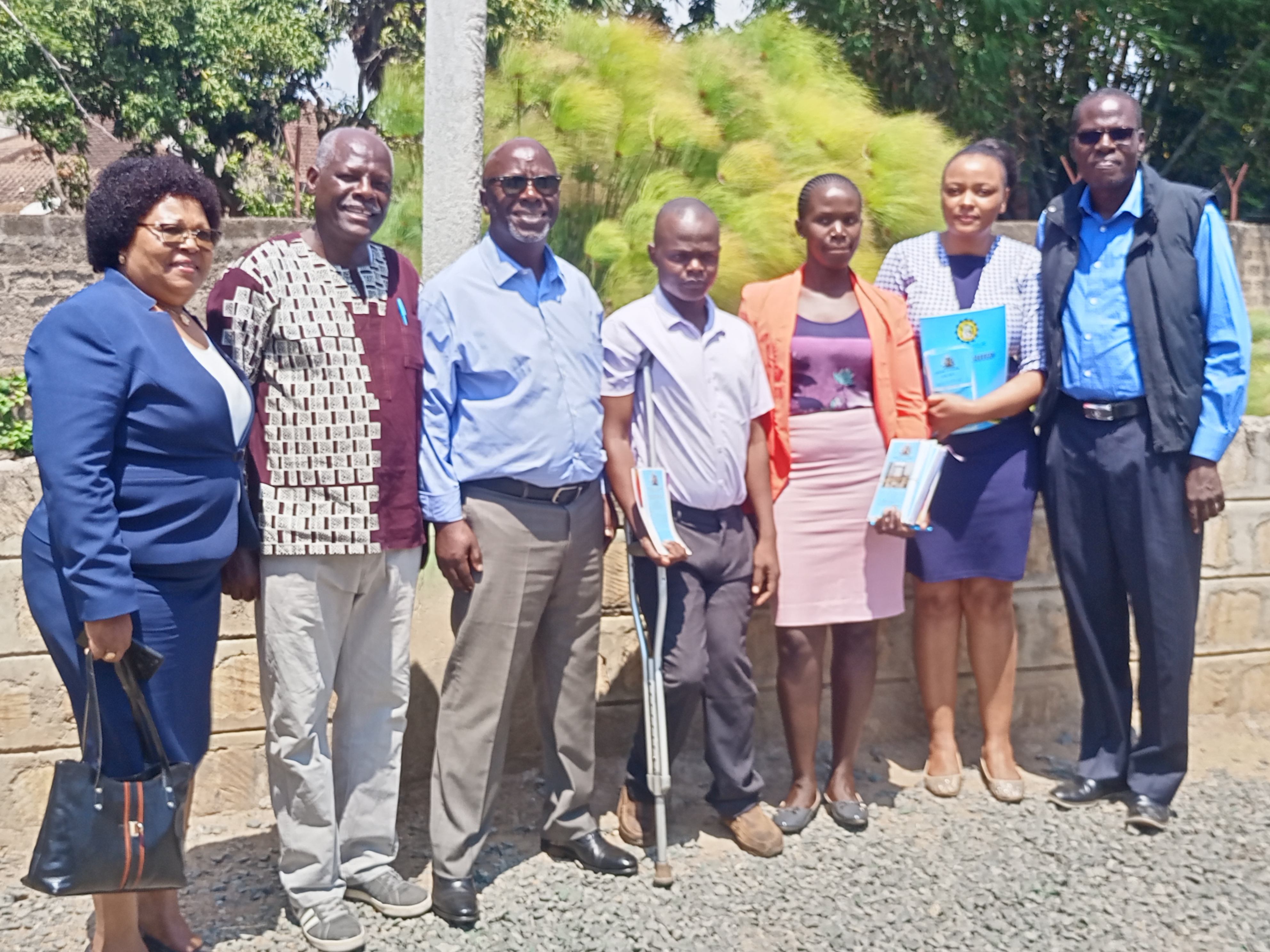 Chairman,Public Service Commission ,Amb.Anthony Muchiri and Dr.Mary Mwiandi pose with interns posted at the University of Nairobi Kisumu Campus